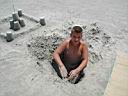 P1010070.jpg: Matt diggin him self out and Sams sand castle